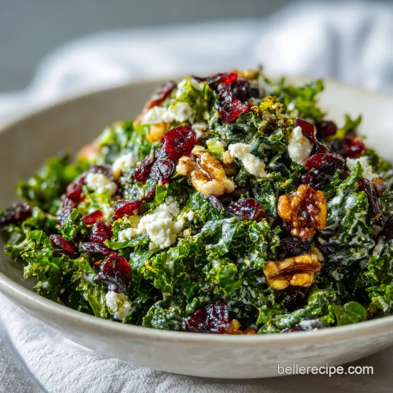 A colorful mound of fresh kale salad artfully arranged on a white plate with a fork, highlighting textures.