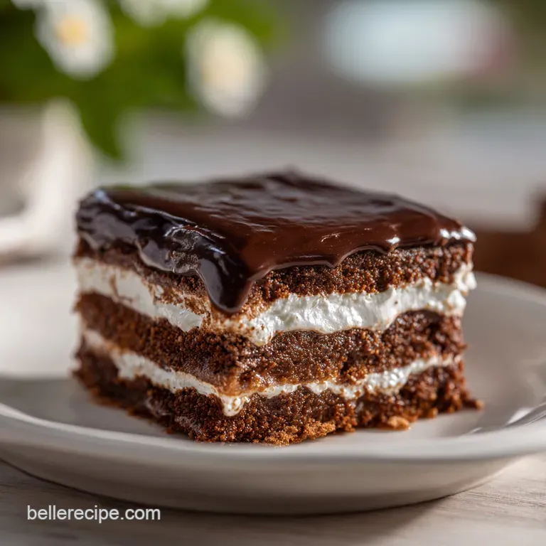 Elegant slice of hot chocolate lasagna with chocolate shavings and a dusting of powdered sugar on a white dessert plate.